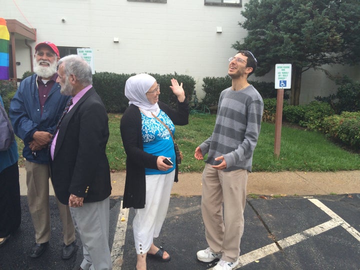 Participants in the 2014 "Spread Hummus Not Hate" chat together during one of the bus' stops.