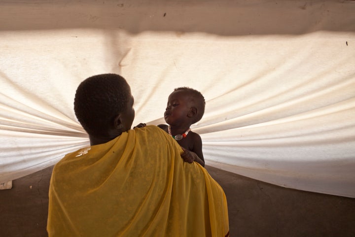 A mother holds her child in a hospital in Lankien, South Sudan.