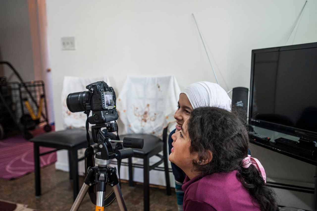 Hajar Darbi, in the foreground, and Nabiha Darbi, behind her, mesmerized by the camera.
