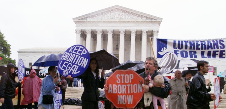 UNITED STATES - APRIL 25: Pro-choice and anti-abortion activists demonstrate in front of the Supreme Court building as arguments on "partial birth" abortion are heard before the court.