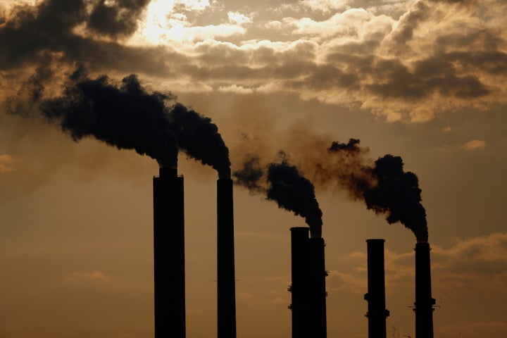 Emissions are seen rising from stacks at the Duke Energy Corp. Gibson Station power plant at dusk in Owensville, Indiana. On Nov. 4, the Sierra Club reported that the U.S. electric sector's carbon emissions are on track to be their lowest since 1995. 