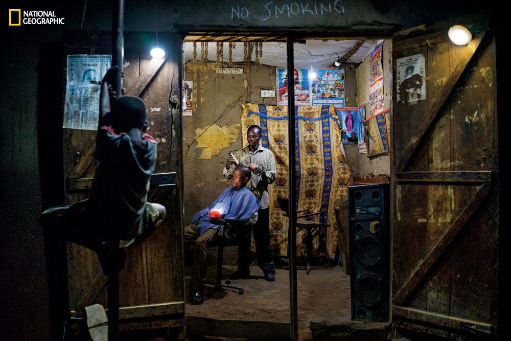 Electricity is a rare luxury in Uganda. Denis Okiror, 30, began using solar lights at his barbershop in Kayunga two years ago. He says most of his customers prefer to visit him in the evening.