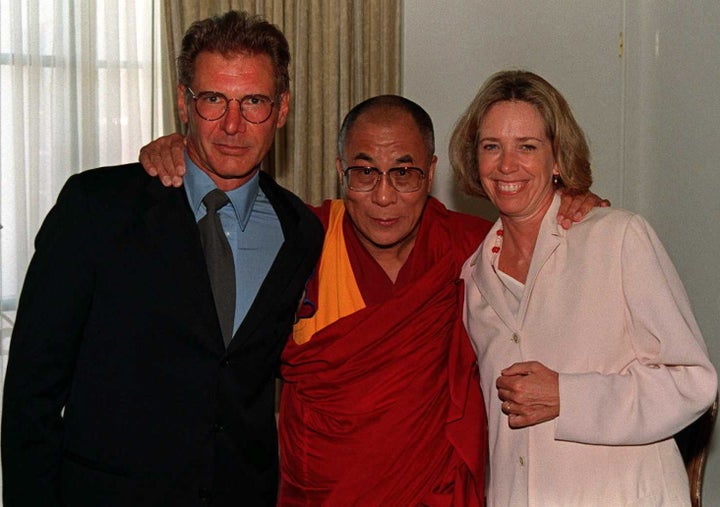 Harrison Ford and Melissa Mathison pose with the Dalai Lama in 1996.