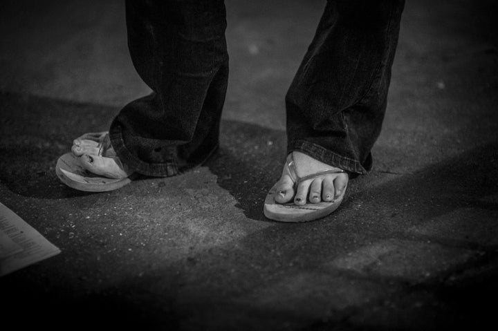 A homeless woman wears flip-flops on October 27, 2014 in London, England.