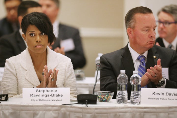 Baltimore Mayor Stephanie Rawlings-Blake (L), Baltimore Interim Police Commissioner Kevin Davis and other community and federal leaders attend the Justice Department Summit on Violence Crime Reduction.