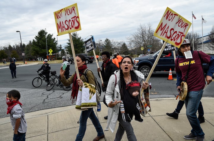 "We are people, not your mascot," shouts Adrianne Plenty Holes at a protest of the name and logo of the Washington footb