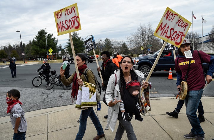 "We are people, not your mascot," shouts Adrianne Plenty Holes at a protest of the name and logo of the Washington football team before a game, Dec. 28, 2014.