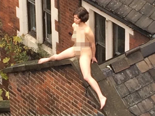 <i>The artist bravely scales the roof before starting her performance.</i>