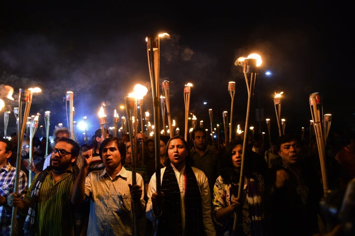 Hundreds protested against the killings of secular writers and publishers on Monday, calling for more government protection.