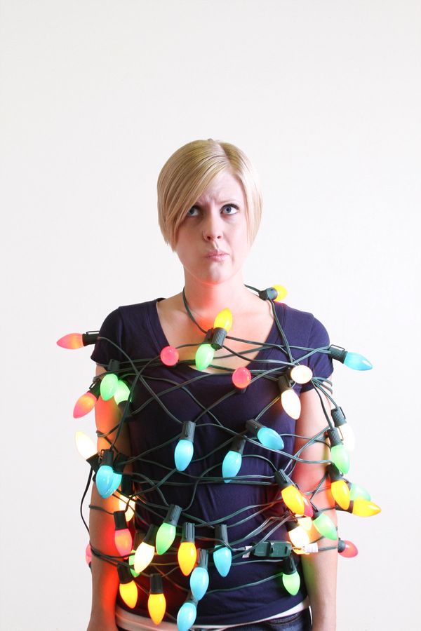 15 Weird Photos Of People Tangled In Christmas Lights 