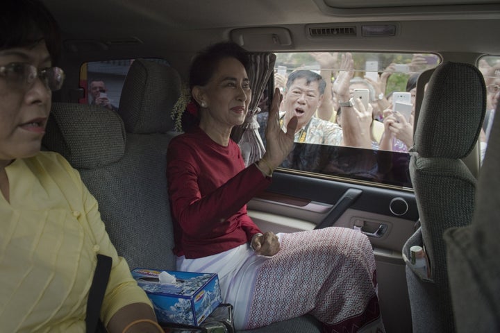 Myanmar opposition leader and head of the National League for Democracy (NLD) Aung San Suu Kyi leaves her house to cast her vote at a polling station in Yangon on November 8, 2015.