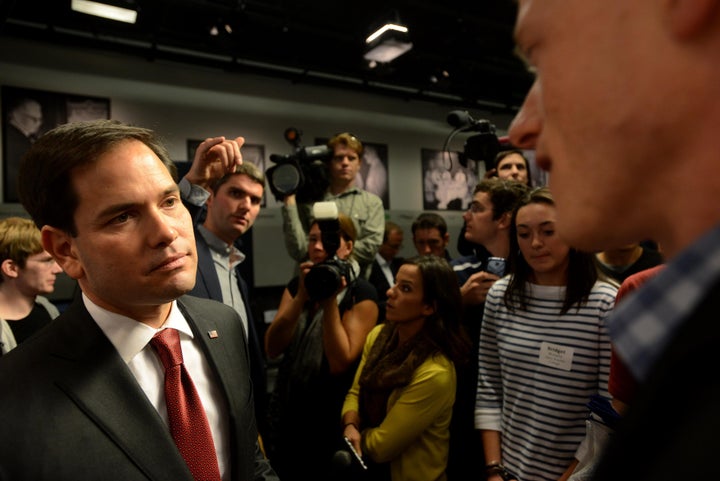 Republican presidential candidate Marco Rubio (R-Fla.) meets people following a round table discussion at Saint Anselm College in Manchester, New Hampshire, Nov. 4. As he rises in the polls, some of his rivals are attacking his past support for immigration reform.