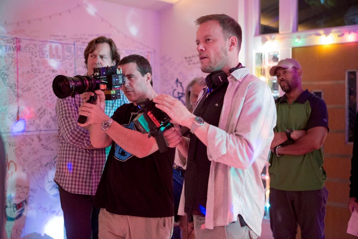 Jason Moore, far right, directs a scene on the set of "Sisters."