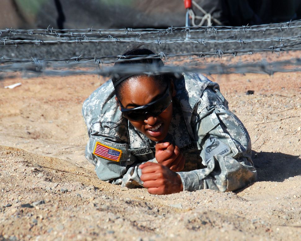 The “dead leg crawl” is one of nine obstacles on the Air Assault obstacle course at Fort Bliss, Texas. Pvt. Sonja