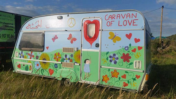 Caravans are being used by migrants and refugees as temporary shelters, as well as by volunteers on the ground. The "Caravan of Love," pictured, was used as a base for volunteers helping in the Jungle's "Big Clean Up" in September.