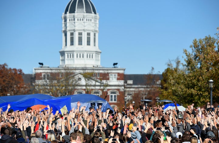 Student protesters on the campus of the University of Missouri in Columbia react to news of the resignation of University of Missouri system President Tim Wolfe on Monday, Nov. 9, 2015.