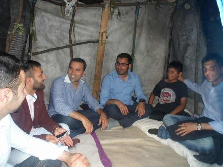 Gulwali Passarlay, third from right, an Afghan studying in the U.K., is calling on Europeans to come together to help solve t