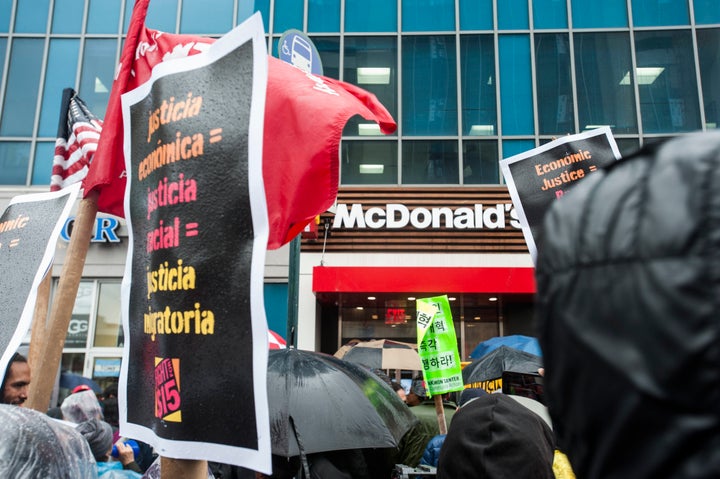 New York City workers protest outside a McDonald's in Harlem on Tuesday.