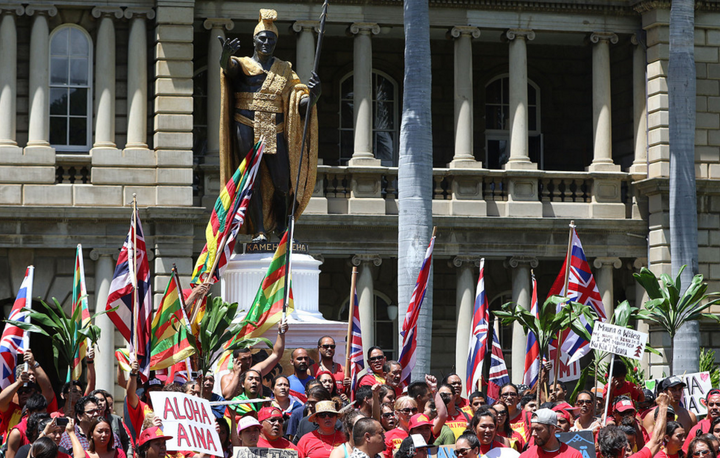 Mauna Kea demonstrators group around the King Kamehameha statue in Honolulu.