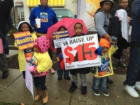 Child care workers and children join a Fight for $15 demonstration outside a fast-food establishment in Richmond, Virginia, on Tuesday.