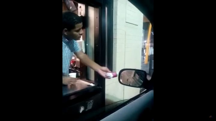 A McDonald's worker has been fired after video captured him baiting a homeless man with a sandwich before throwing water on him.