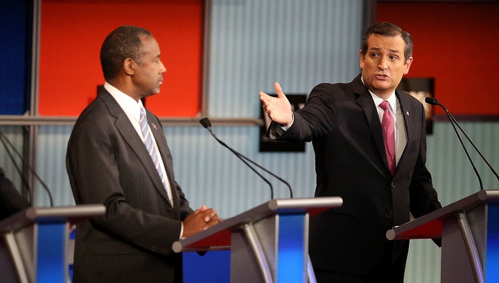 Republican presidential candidate Ben Carson (C) looks on as Sen. Ted Cruz (R-Texas) speaks during the Republican Presidential Debate. The evening was full of positive messages for Wall Street.