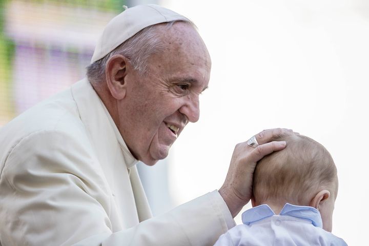 Pope Francis greets a baby during his Weekly General Audience on Nov. 11 in St. Peter's Square in Vatican City.