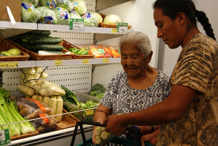 Shoppers inside MoGro's mobile grocery trailer in San Felipe Pueblo in New Mexico.