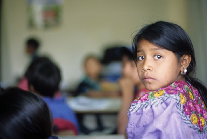 Portrait of a young Mayan student in her classroom in Guatemala.