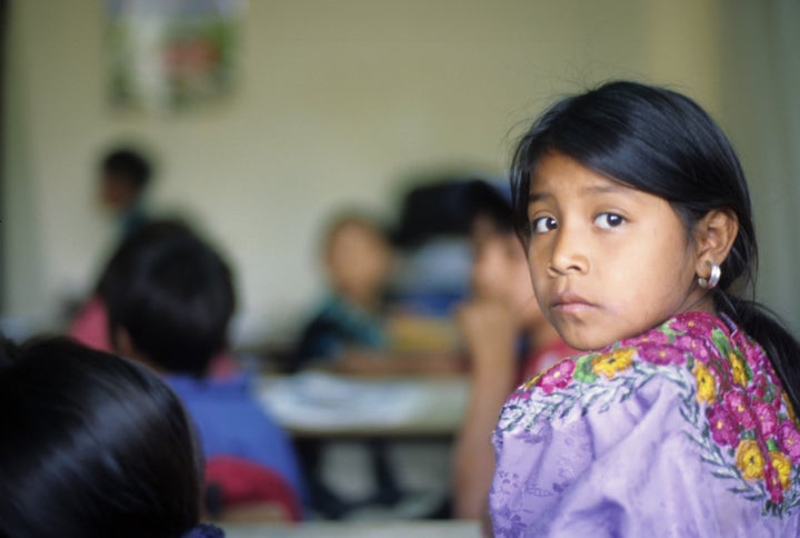 Portrait of a young Mayan student in her classroom in Guatemala.