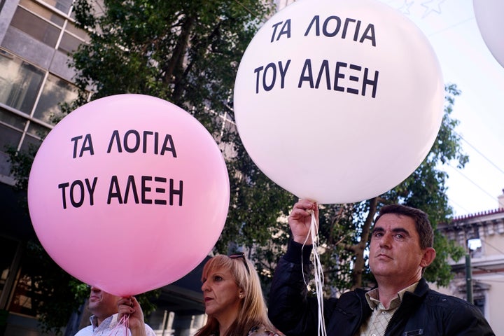 Some demonstrators held pink balloons with "The Promises of Alexis" written on them, suggesting the prime minister's words were empty.