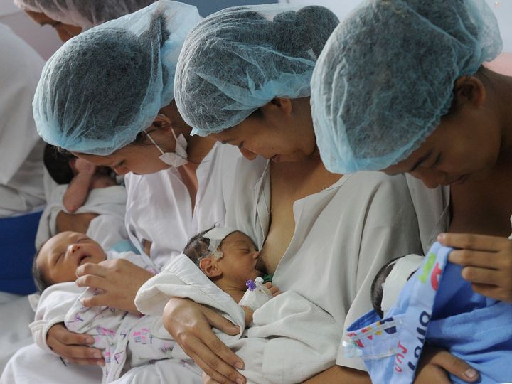 Mothers breastfeed their newborn babies at the Fabella Hospital in Manila on May 8, 2015, ahead of Mother's Day which will be celebrated on May 10 in the Philippines.