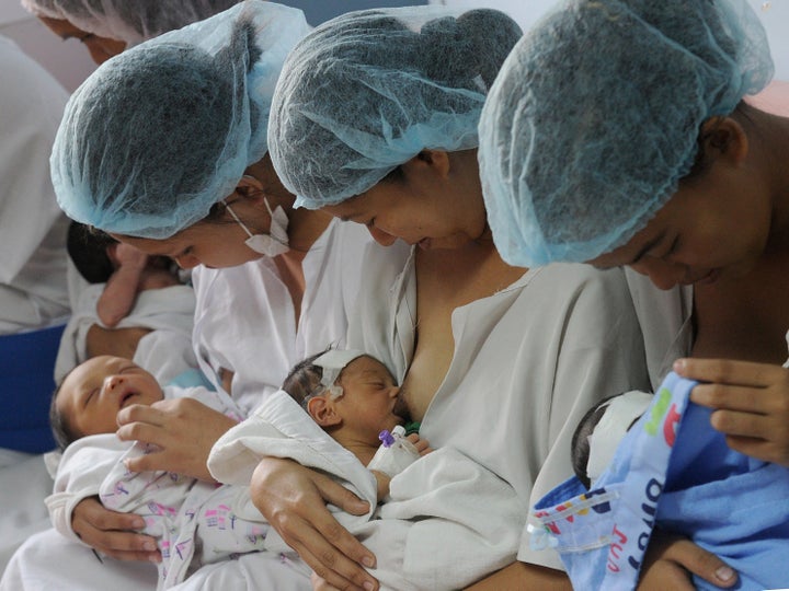 Mothers breastfeed their newborn babies at the Fabella Hospital in Manila on May 8, 2015, ahead of Mother's Day which will be