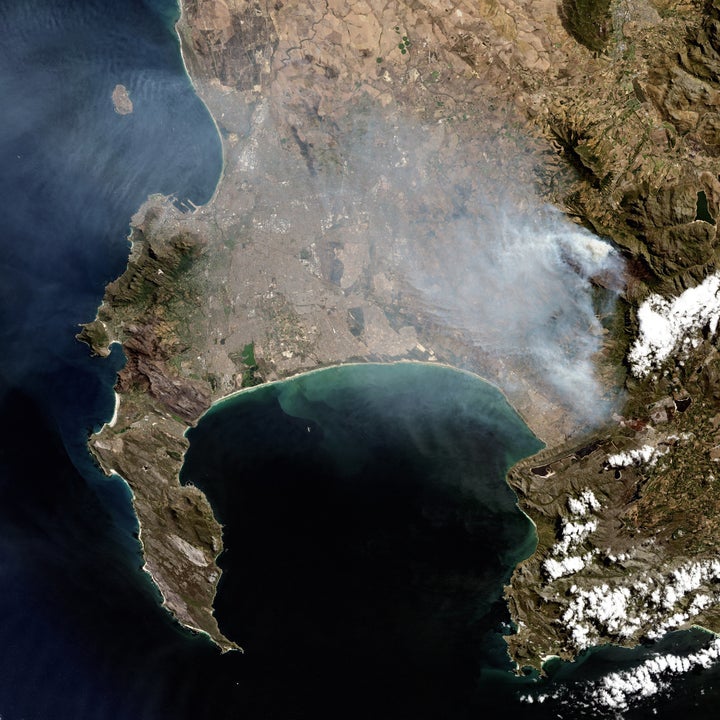 A natural satellite view of the Cape Town wildfires on March 11, 2015, in Cape Town, South Africa. This image gives a closer view of the area of interest along with Robbin Island and Cape Point with False Bay. The recent Cape Town fire destroyed over 5,500 hectares of the Western Cape.