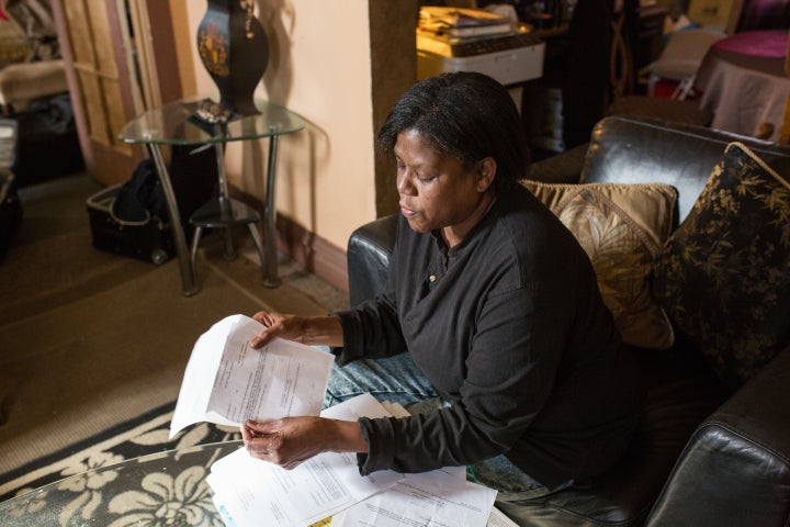 Valarie Whitner looks over city documents.