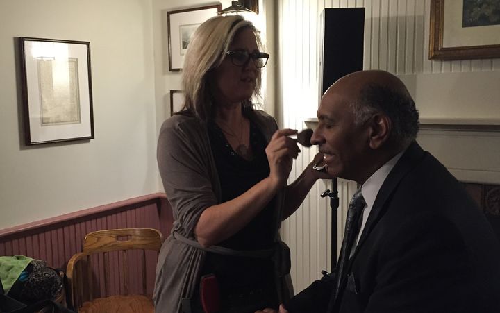 Kriss Blevens applies makeup to former RNC Chairman Michael Steele.