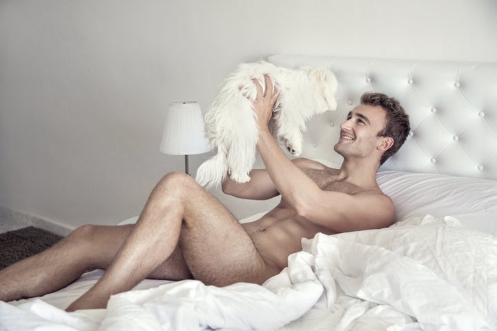 Lucas Etienne cuddles with a furry friend.