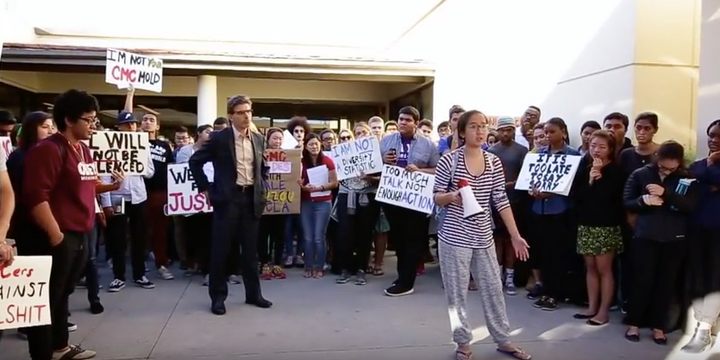 Claremont McKenna College Hiram Chodosh listens to an activist on campus on Wednesday.
