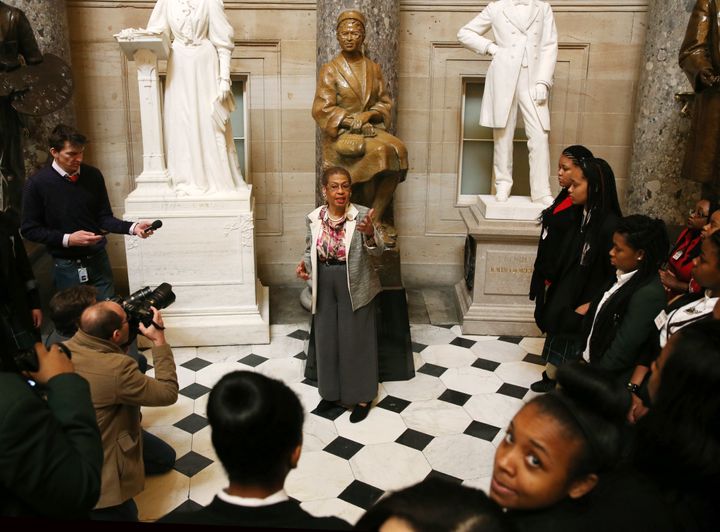 Del. Eleanor Holmes Norton (D-D.C.) talks to a group of schoolchildren in front of a statue of Rosa Parks. inside Statuary Hall in the U.S. Capitol.