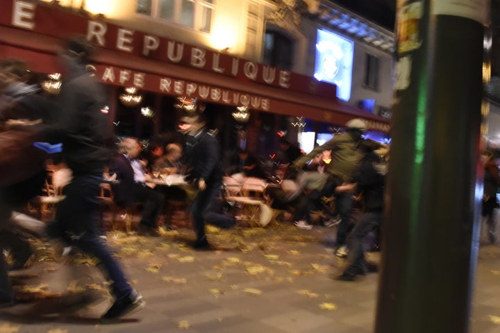 People run after hearing what is believed to be explosions or gunshots near the Place de la Republique square.