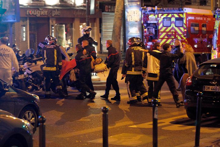 Medics move a wounded man near the Boulevard des Filles-du-Calvaire after an attack November 13, 2015 in Paris, France. (Thierry Chesnot via Getty Images)