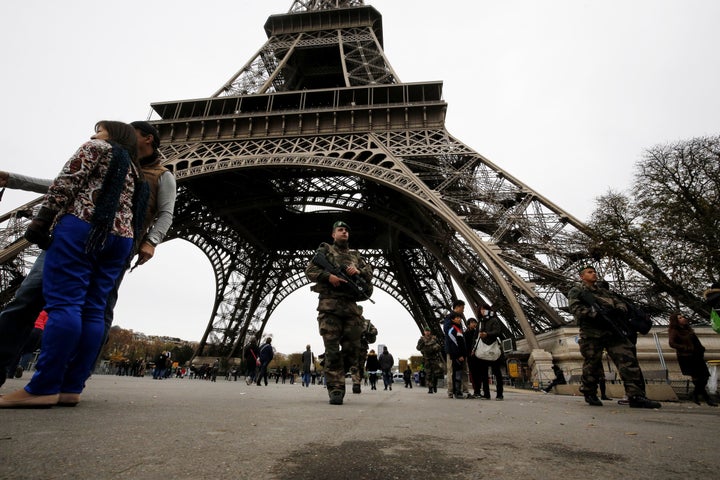 French soldiers patrol the area at the foot of the Eiffel Tower in Paris on Nov. 14, 2015.