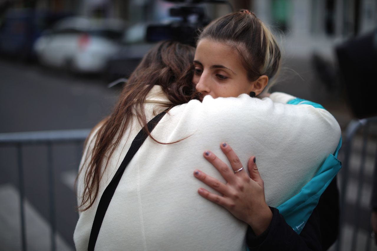 Women console each other near the scene of the Bataclan Theater terrorist attack on Nov. 14, 2015 in Paris, France.