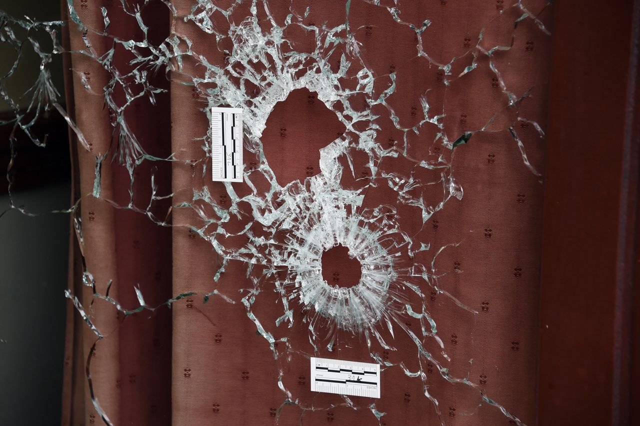 Bullet holes scar the windows of the Carillon and the adjacent Cambodian restaurant on Rue Alibert in the 10th district of the French capital Paris, on Nov.14, 2015, the morning after an attack that killed 12 people at the restaurant.