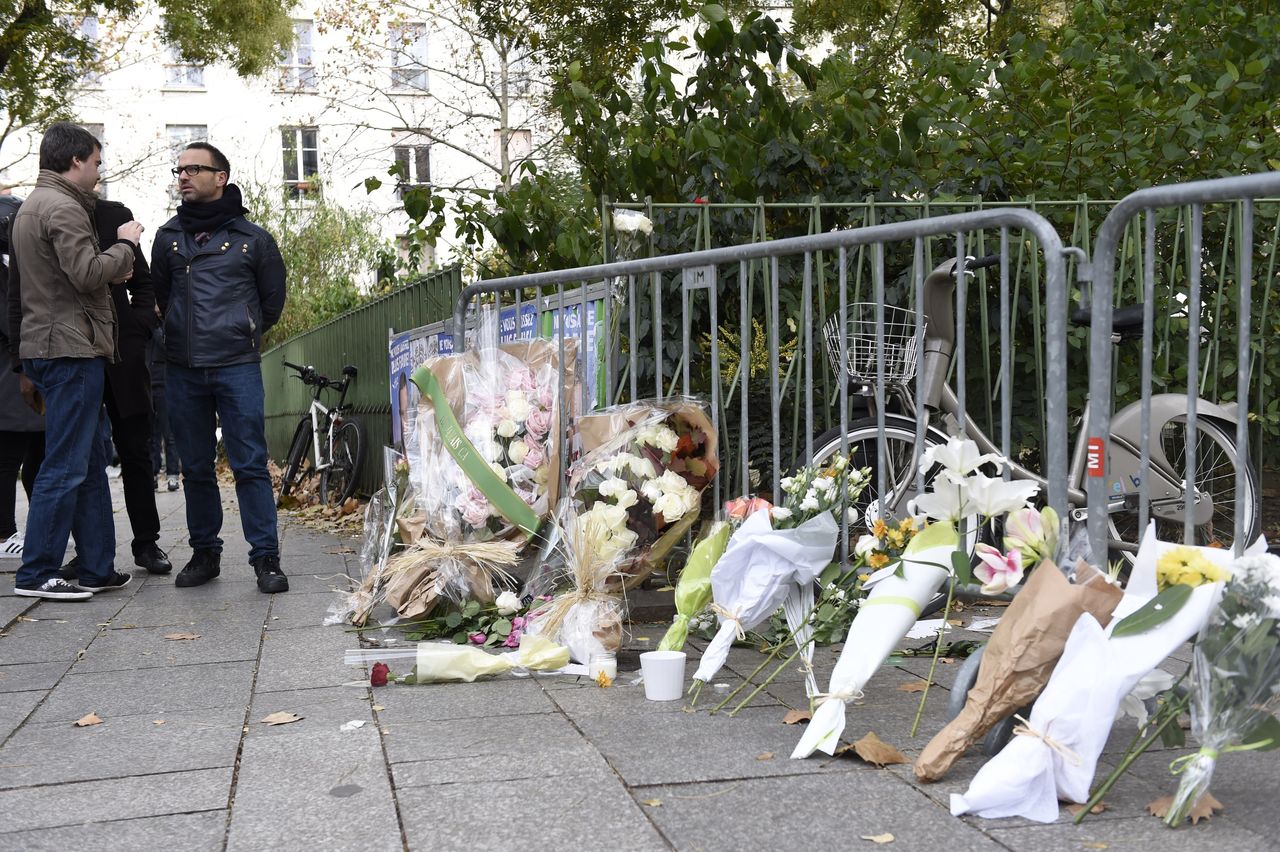 Flowers laid along a fence cordon close to the Bataclan theatre in the 11th district of Paris, on Nov. 14, 2015.