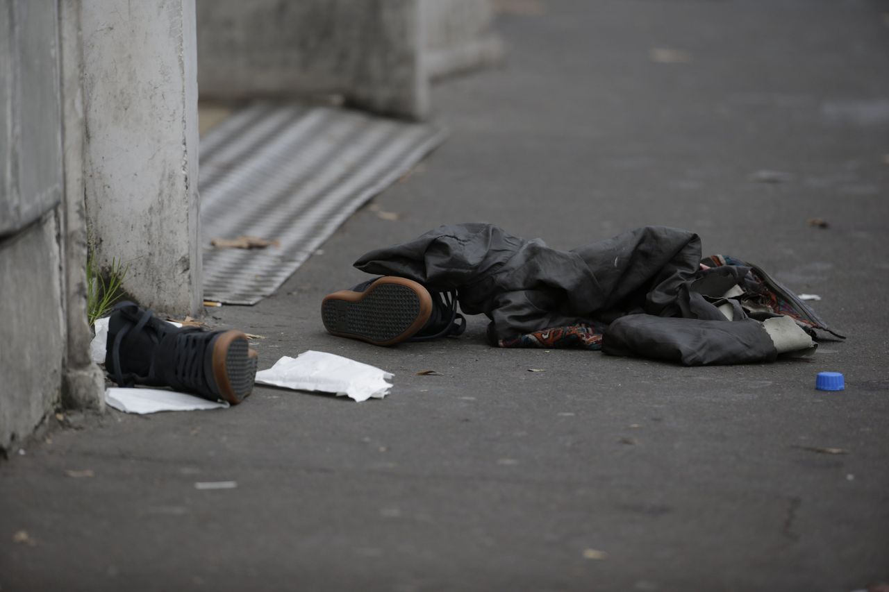 Personal items believed to belong to a fleeing concertgoer lie on the pavement near the Bataclan theatre in the 11th district of Paris on Nov. 14, 2015.