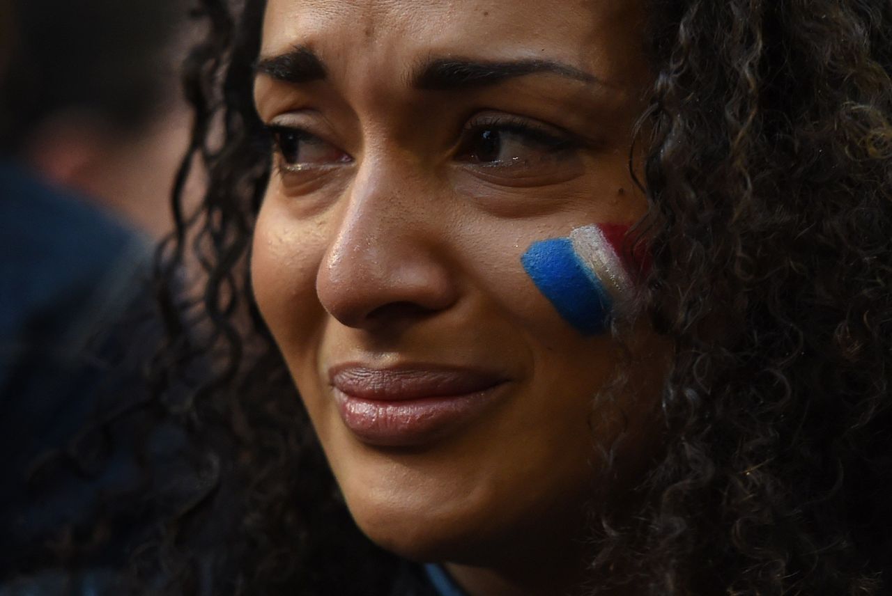 A woman weeps at a vigil held by the local French community in Sydney on Nov. 14, 2015.