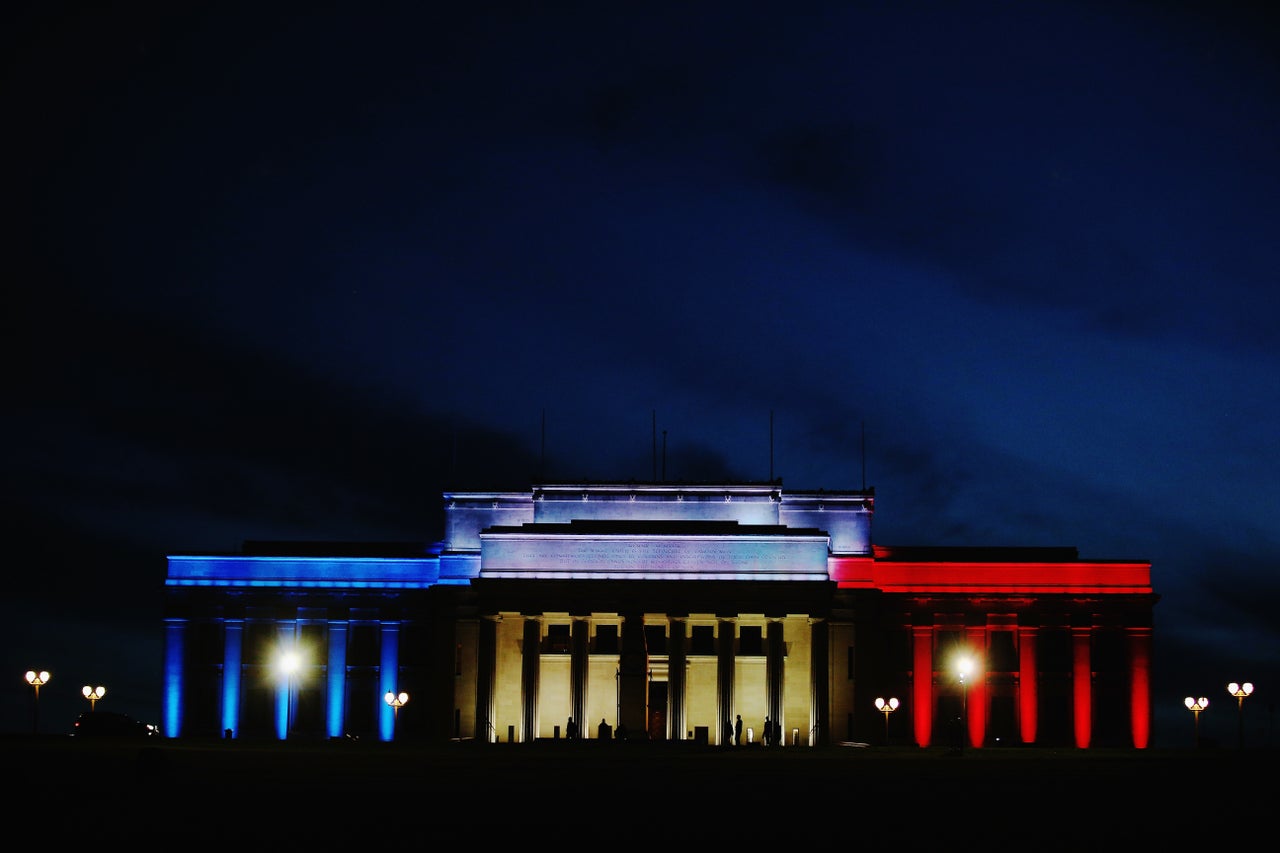 Lights in the colors of the French flag light up the Auckland Museum to remember victims of the Paris attacks on Nov. 14, 2015.