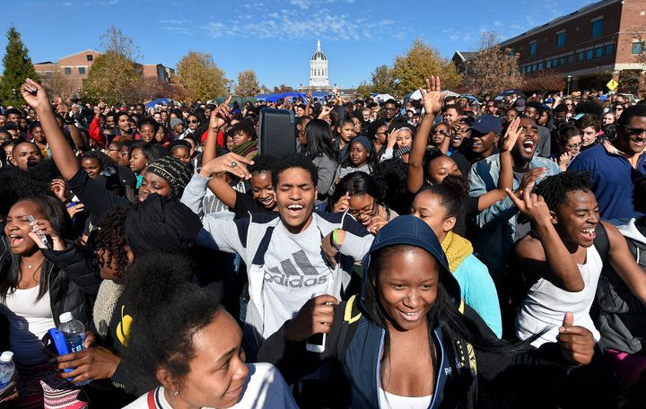 Student protesters on the campus of the University of Missouri in Columbia react to news of the resignation of University of Missouri system President Tim Wolfe on Monday, Nov. 9, 2015.