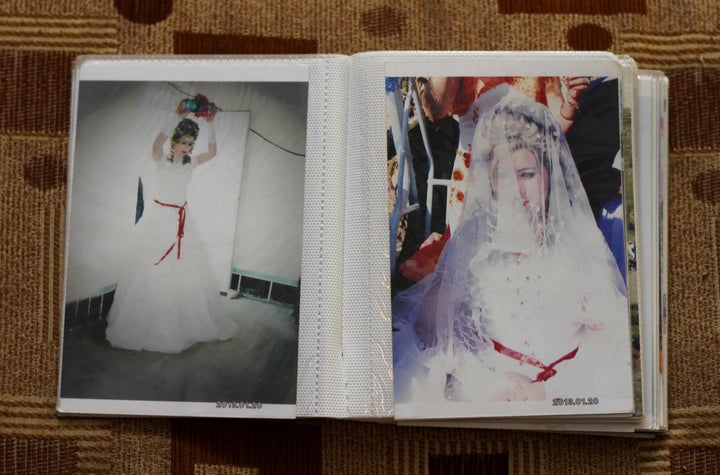 Bassima, a Yazidi woman displaced from Sinjar when ISIS took over, is seen in her wedding photographs. The photos are some of the only belongings her husband recovered from their home. 